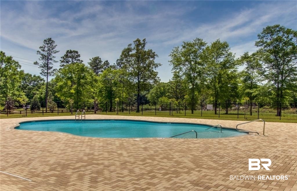 2345 Laurel Street Semmes, AL 36575 - Photo 27 of 31 View of swimming pool with a patio and view of scattered trees