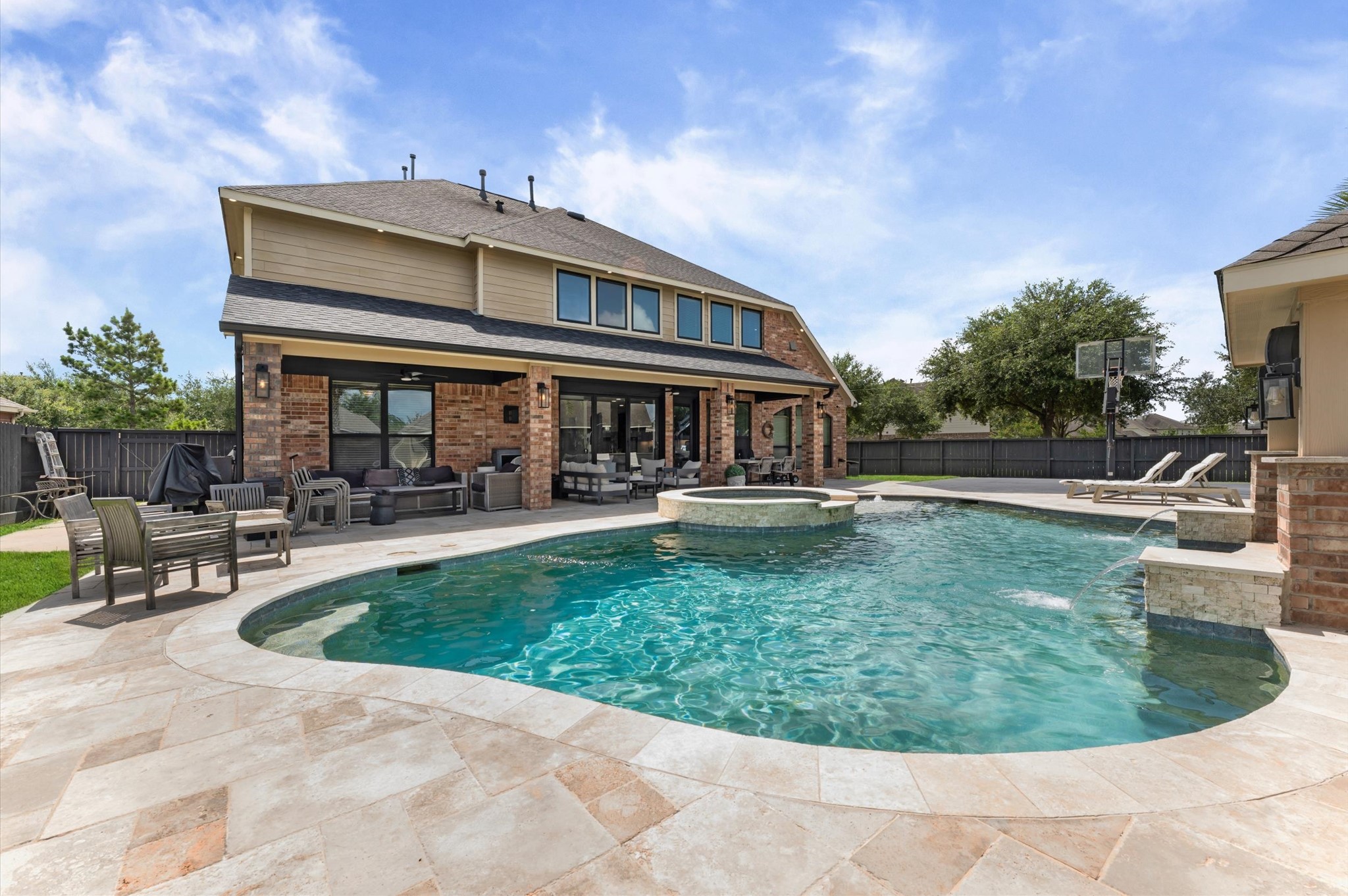 14016 Savannah Landing Lane Rosharon, TX 77583 - Photo 36 of 49 a view of a house with swimming pool and sitting area