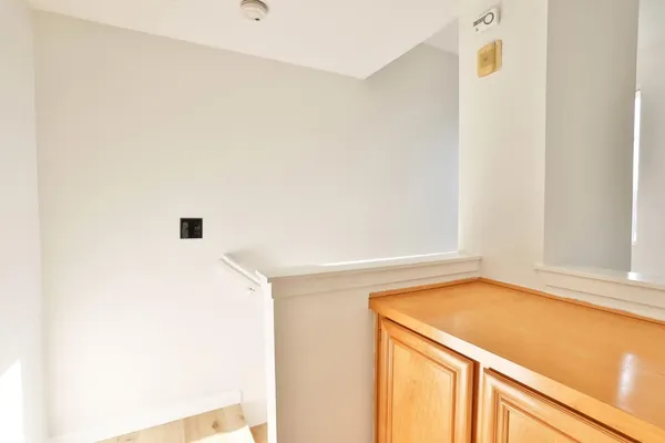 a view of a kitchen with a fridge