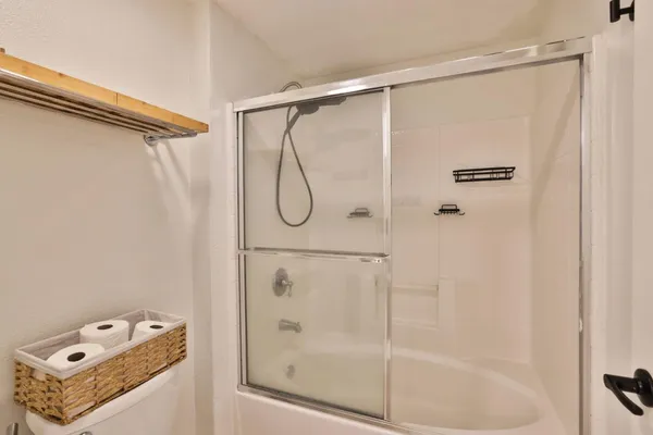 a bathroom with a shower and a shower