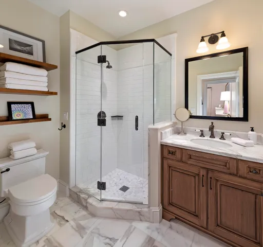 a bathroom with a toilet sink and shower