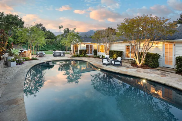 a view of swimming pool with outdoor seating