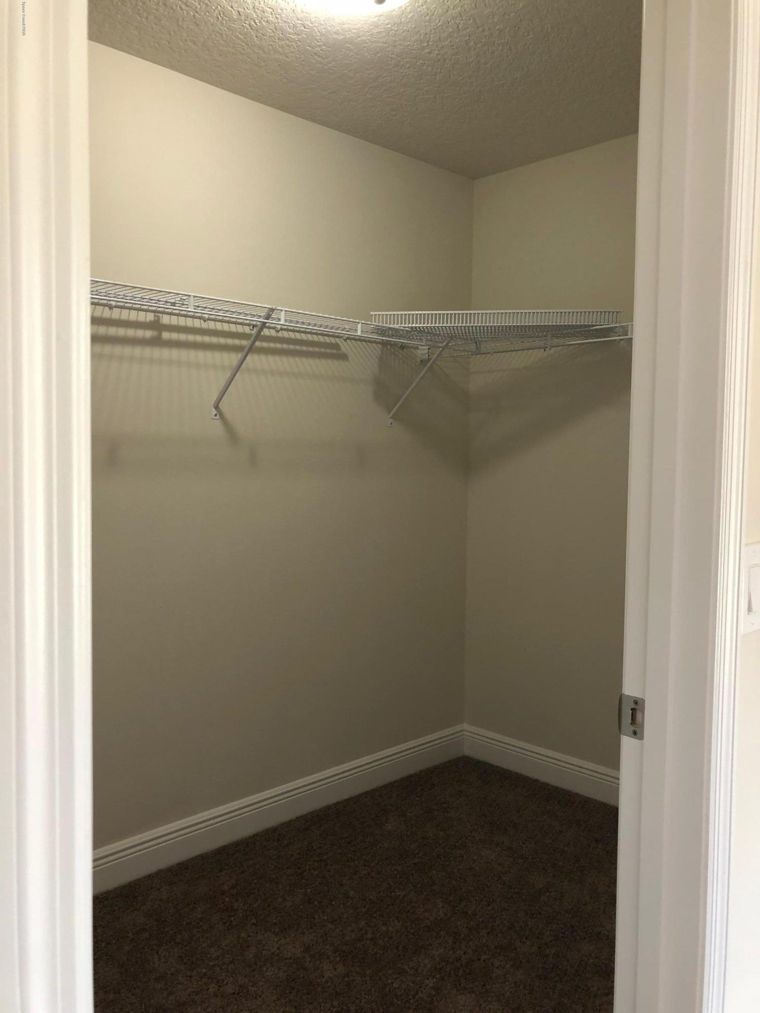 1106 Satin Road Palm Bay, FL 32908 - Photo 7 of 9 master walk in closet