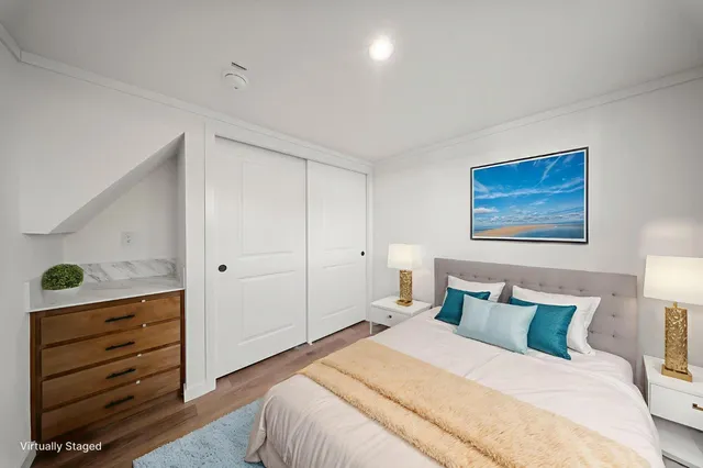 a bedroom with a bed and a dresser