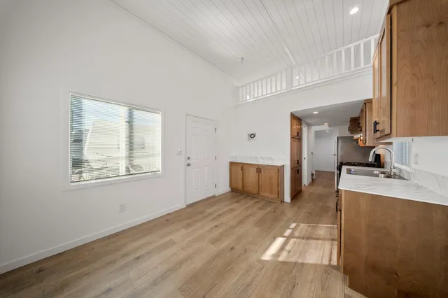 a large room with gym equipment and a window