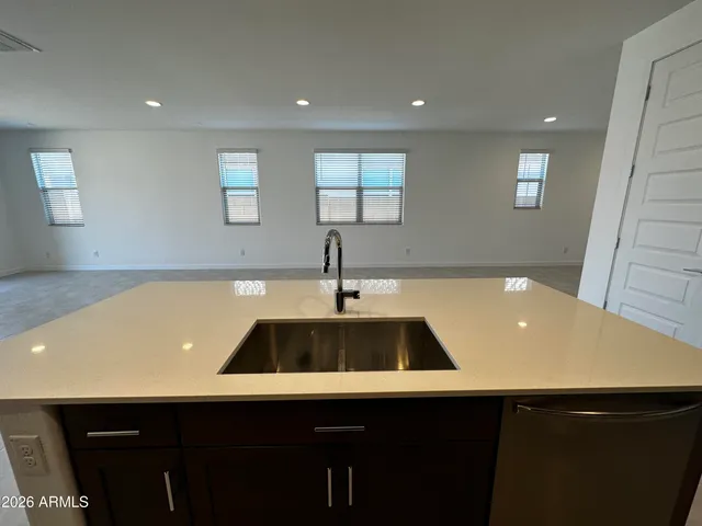 a view of a room with shelves and wooden floor