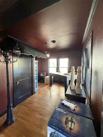 a room with furniture and a gym machine