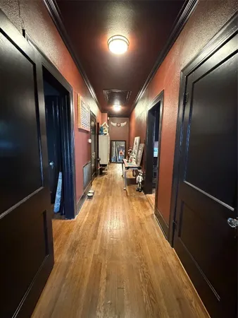 a view of gallery with wooden floor