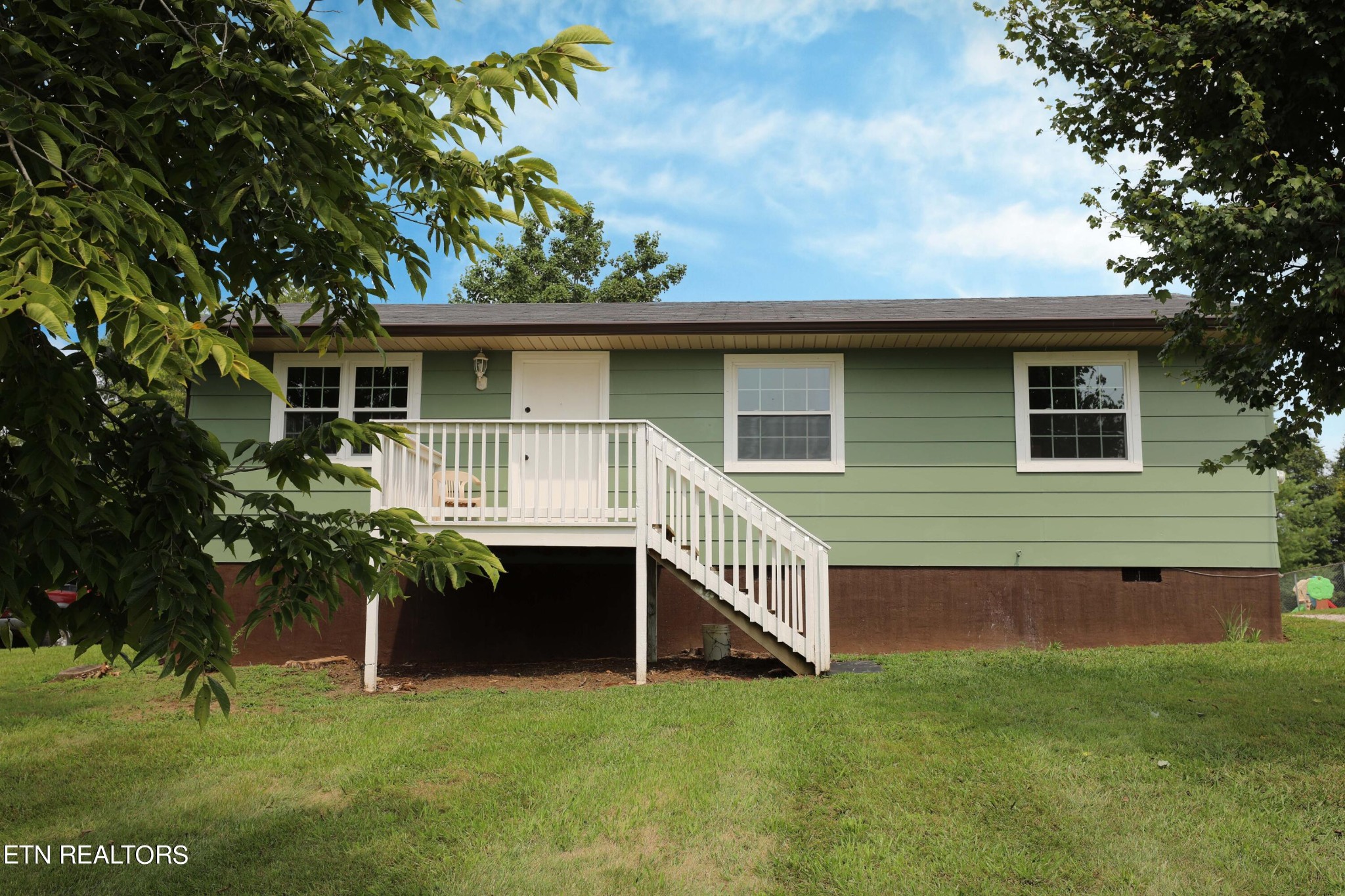 a house with a garden in front of it
