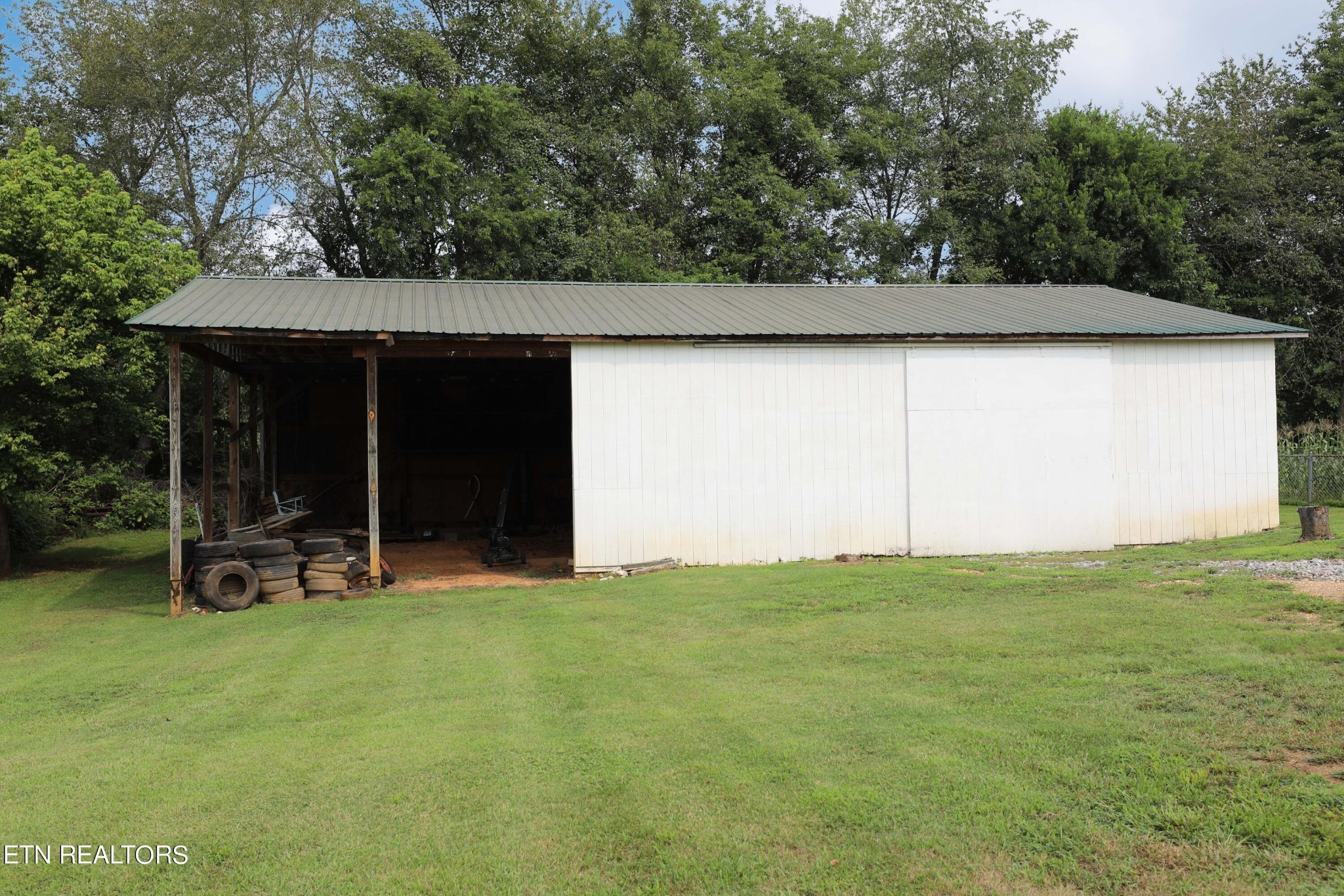 7816 Majors Road Corryton, TN 37721 - Photo 11 of 13 a view of a bench in the backyard of a house