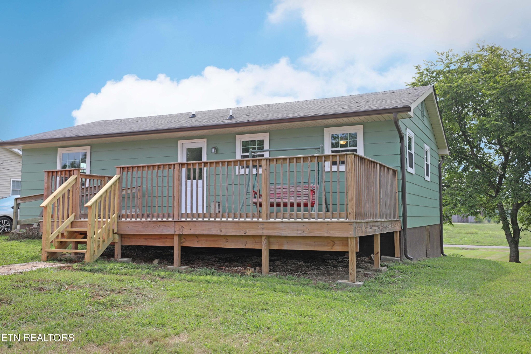 7816 Majors Road Corryton, TN 37721 - Photo 2 of 13 a view of a house with a wooden deck and a yard