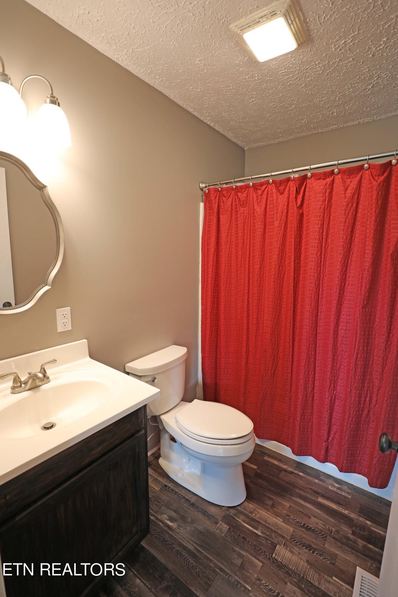 7816 Majors Road Corryton, TN 37721 - Photo 10 of 13 a bathroom with a sink a toilet and shower