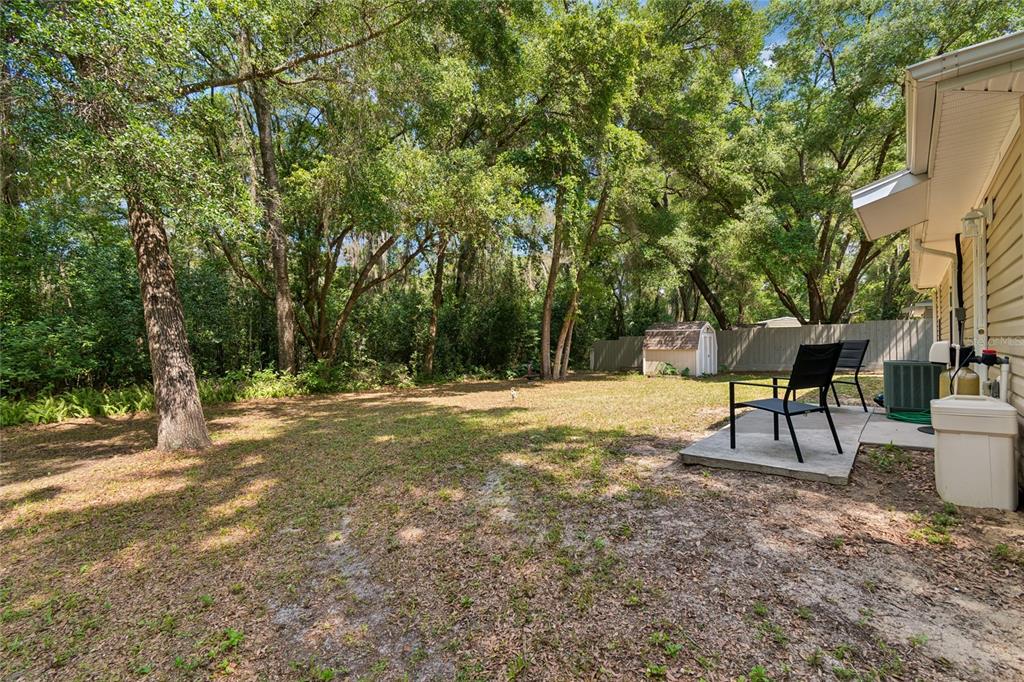 468 North Wheeler Avenue Inverness, FL 34453 - Photo 20 of 24 a backyard of a house with table and chairs