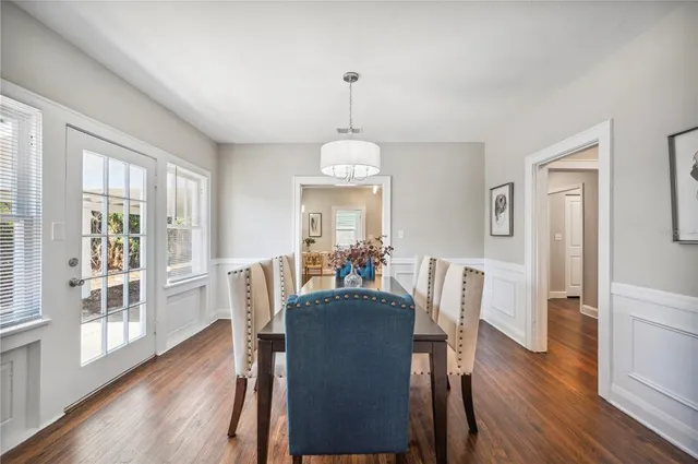 a view of a dining room with furniture window and wooden floor