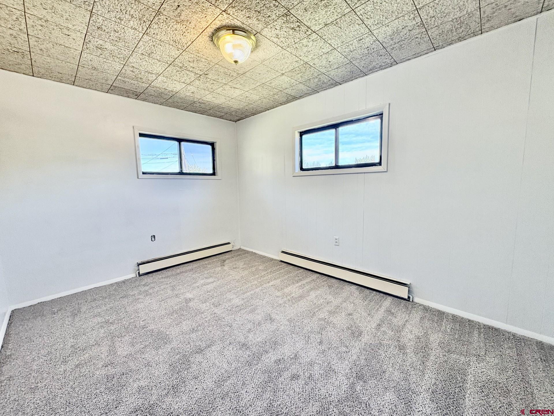 1738 East 7th Street Delta, CO 81416 - Photo 18 of 38 an empty room with a bench