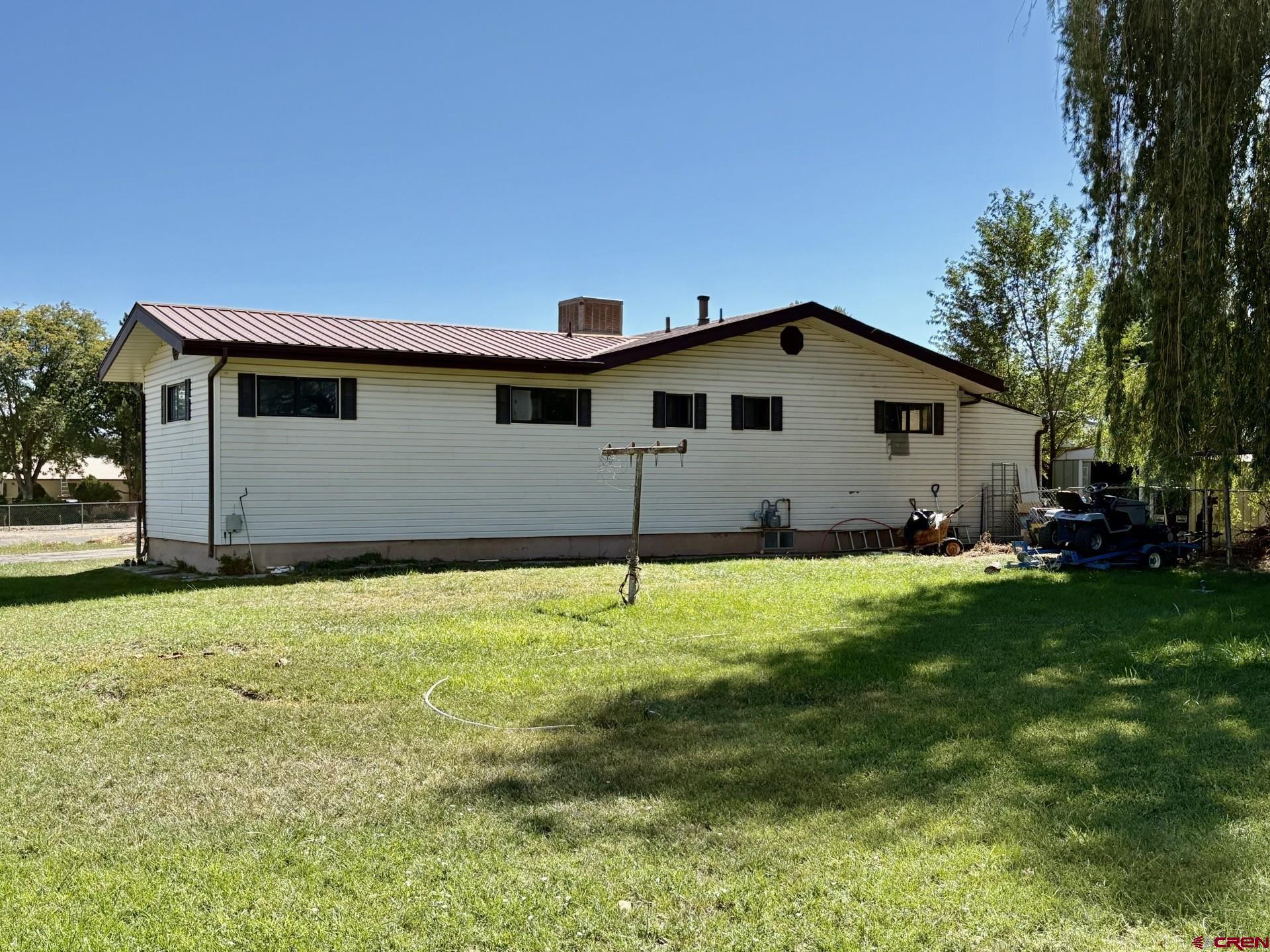 1738 East 7th Street Delta, CO 81416 - Photo 6 of 38 a house with a yard