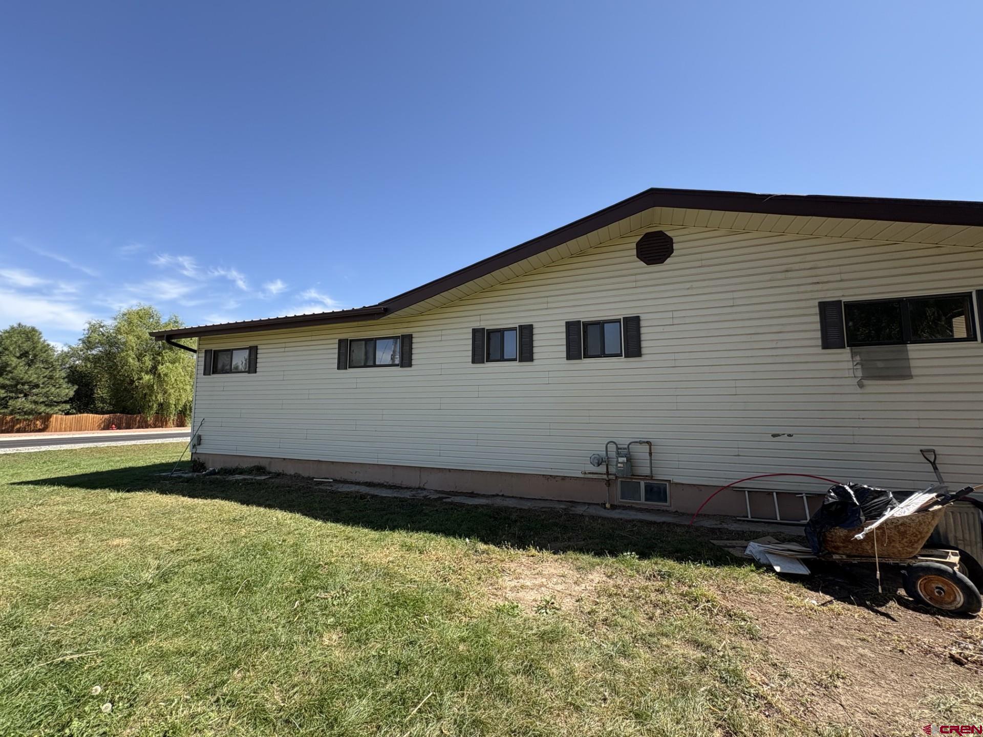 1738 East 7th Street Delta, CO 81416 - Photo 7 of 38 a front view of a house with a yard