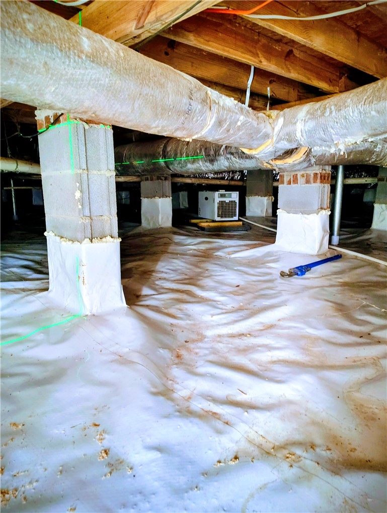 1809 Busby Road Anderson, SC 29626 - Photo 38 of 43 This clean and well-maintained crawl space features durable support piers and efficient ductwork, ensuring optimal structural integrity.