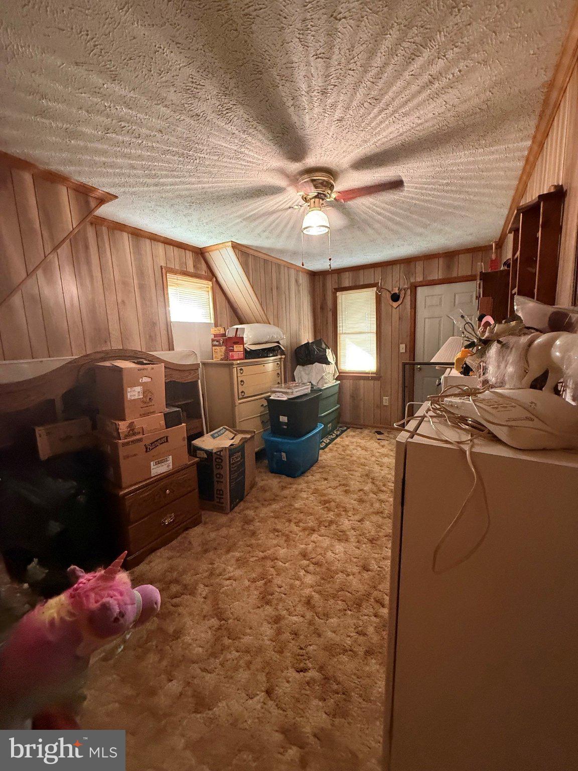 1492 Dice Warner Road Circleville, WV 26804 - Photo 20 of 36 Cozy room with rustic charm.