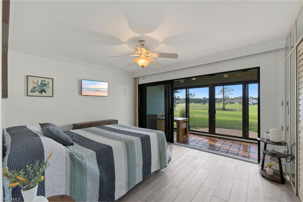 646 Augusta Boulevard Naples, FL 34113 - Photo 30 of 43 a bed sitting in a spacious bedroom next to a window