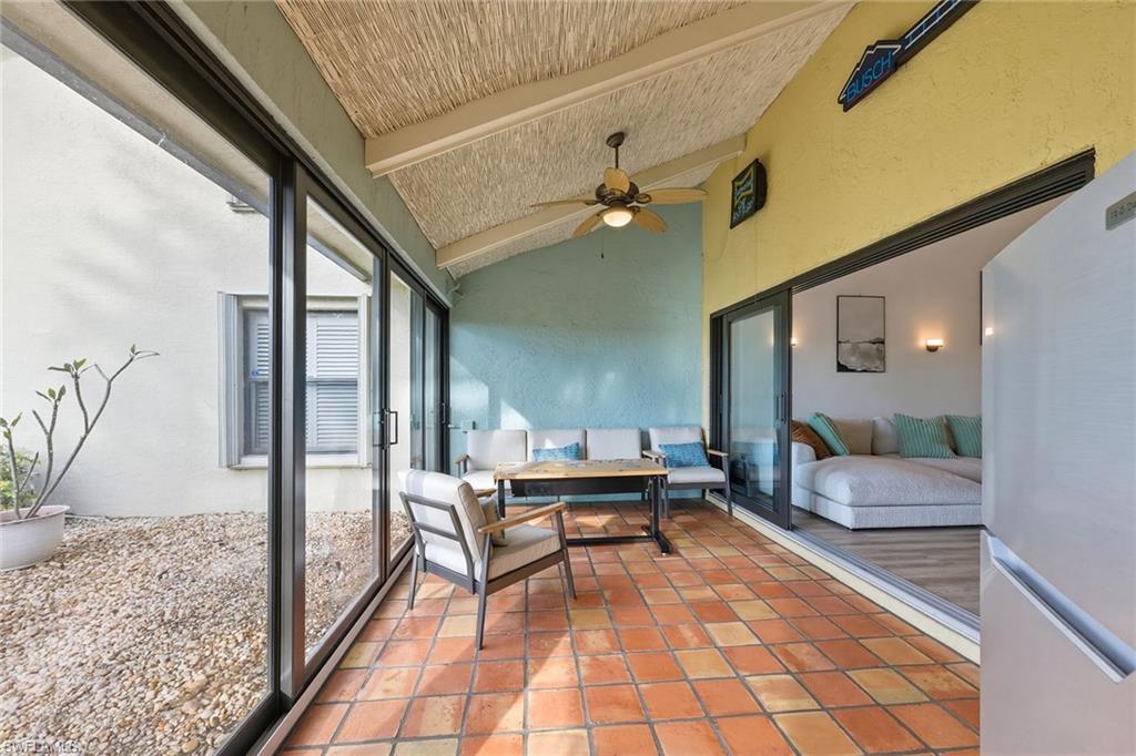 646 Augusta Boulevard Naples, FL 34113 - Photo 35 of 43 a outdoor space with lots of tables and chairs