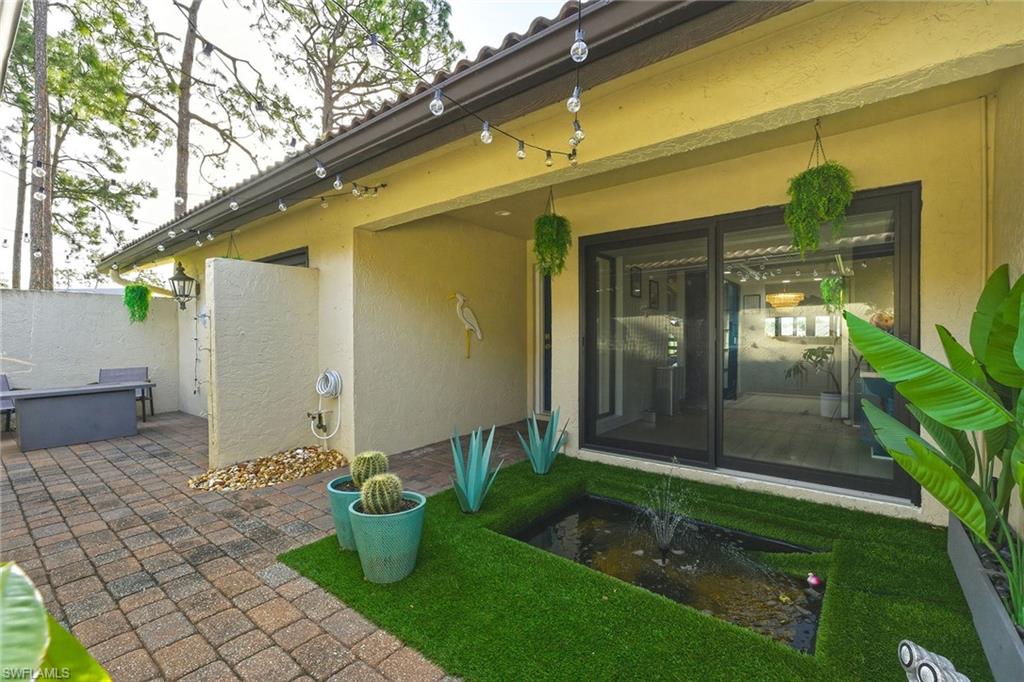 646 Augusta Boulevard Naples, FL 34113 - Photo 4 of 43 a view of a back yard of the house