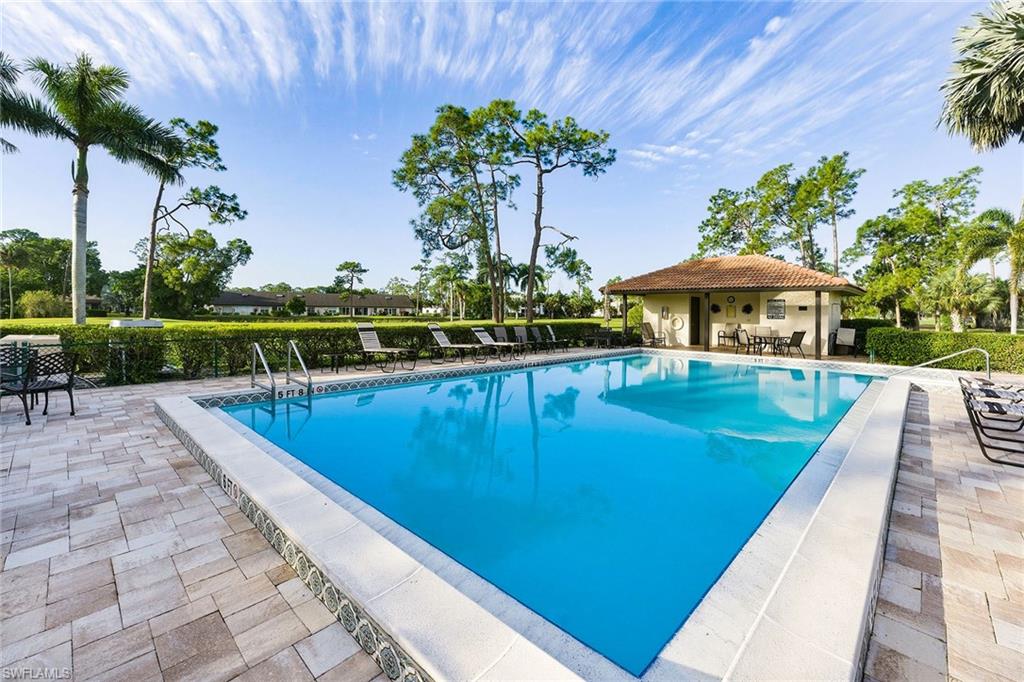 646 Augusta Boulevard Naples, FL 34113 - Photo 42 of 43 a view of a swimming pool with a patio
