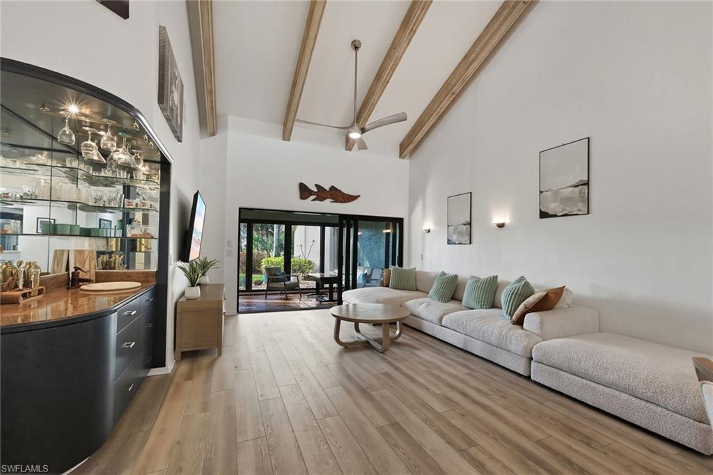 646 Augusta Boulevard Naples, FL 34113 - Photo 9 of 43 a living room with furniture and wooden floor