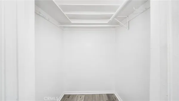 a view of a small space with racks on the wall