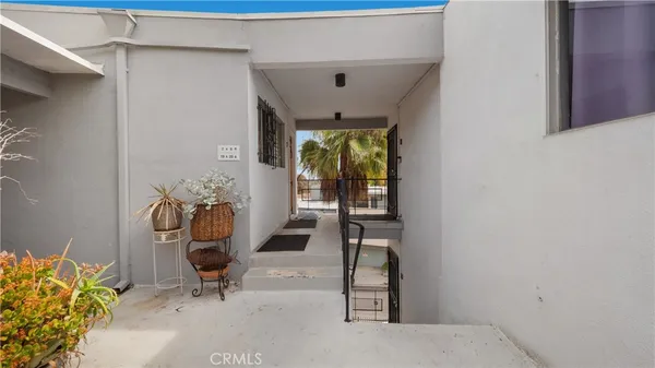 a view of an entryway with wooden floor