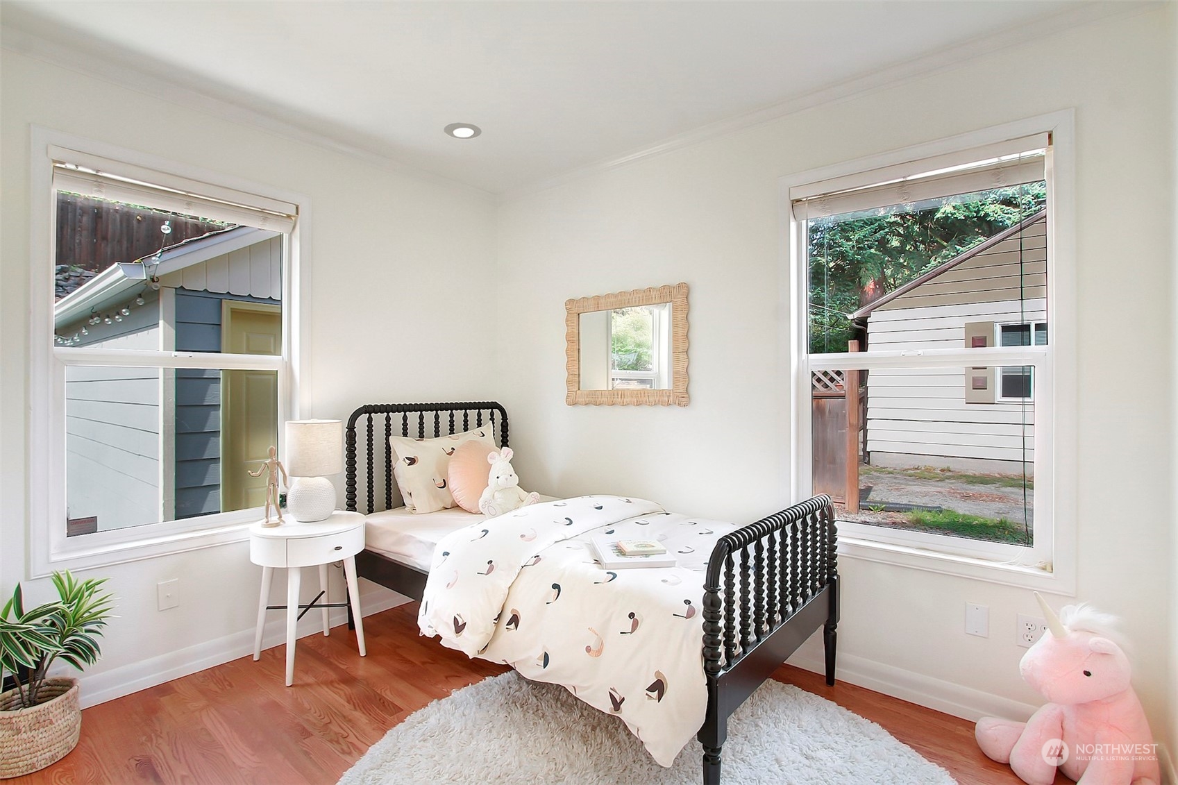 9913 32nd Avenue Southwest Seattle, WA 98126 - Photo 18 of 29 a bedroom with a bed and a window