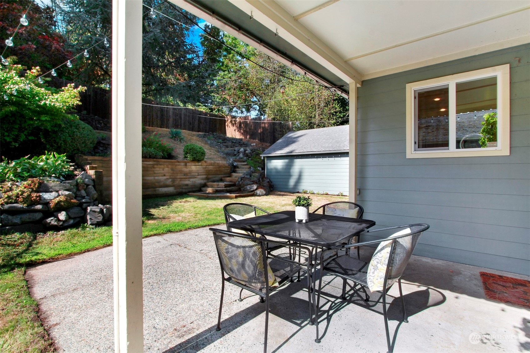 9913 32nd Avenue Southwest Seattle, WA 98126 - Photo 19 of 29 a view of backyard with a patio and outdoor seating