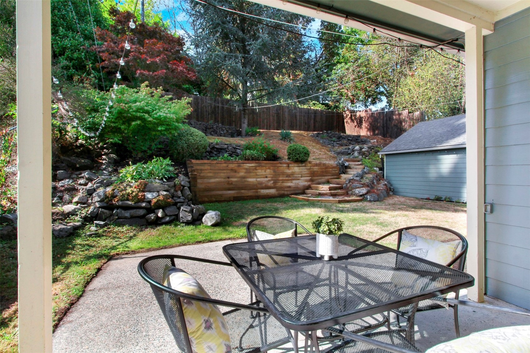 9913 32nd Avenue Southwest Seattle, WA 98126 - Photo 20 of 29 a swimming pool with outdoor seating and plants