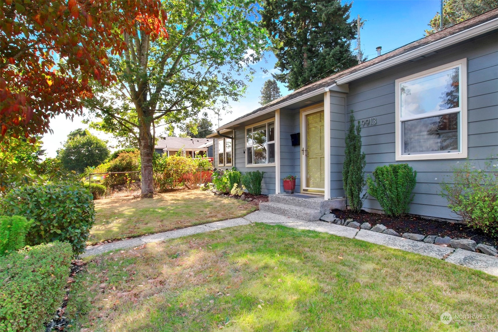 9913 32nd Avenue Southwest Seattle, WA 98126 - Photo 2 of 29 a view of a house with backyard and sitting area