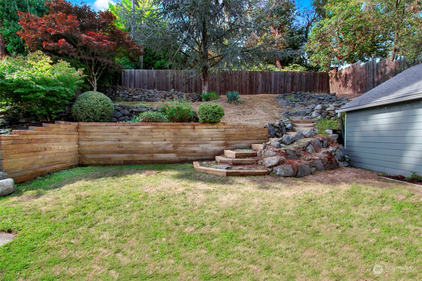 9913 32nd Avenue Southwest Seattle, WA 98126 - Photo 23 of 29 a backyard of a house with lots of green space
