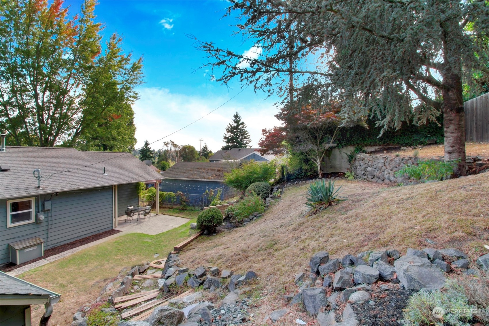 9913 32nd Avenue Southwest Seattle, WA 98126 - Photo 24 of 29 a front view of a house with a yard