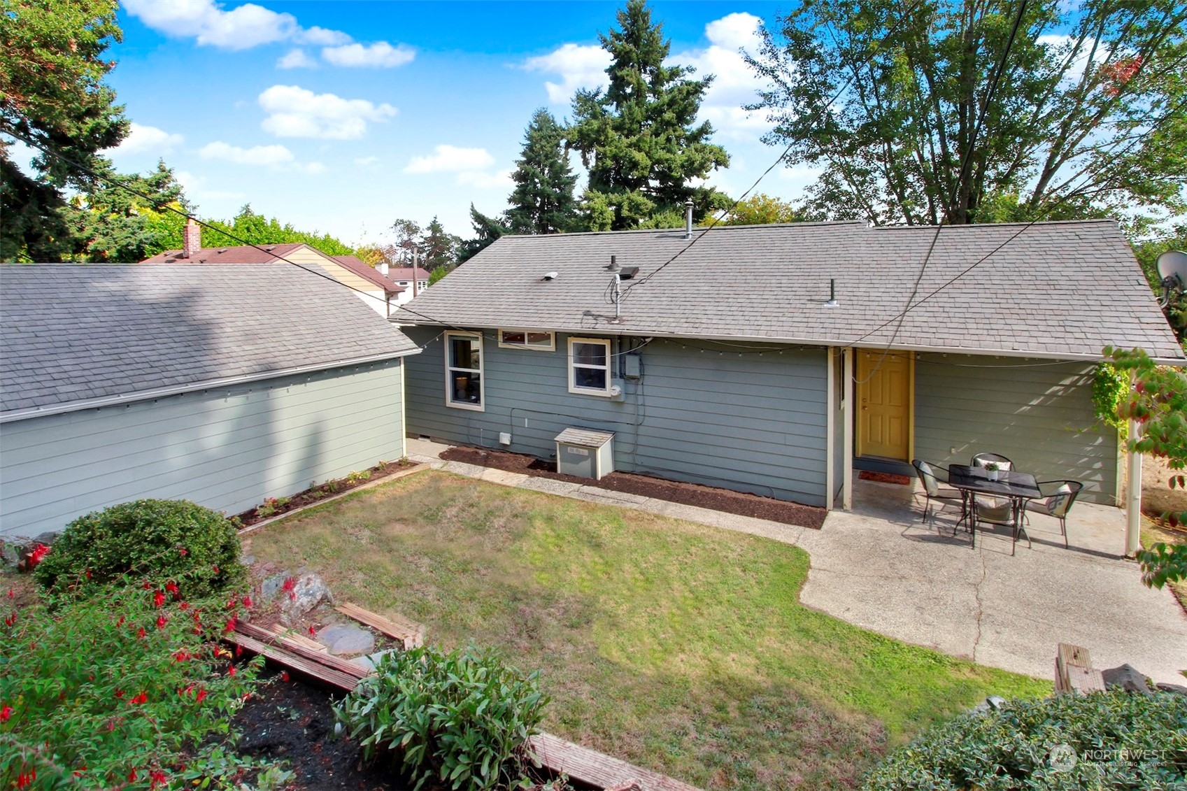 9913 32nd Avenue Southwest Seattle, WA 98126 - Photo 25 of 29 a backyard of a house with yard and outdoor seating