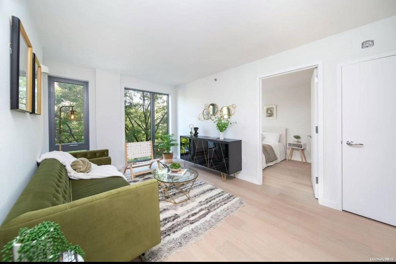 136-80 41st Avenue, Unit 7B Queens, NY 11355 - Photo 3 of 7 Living room with wood finished floors