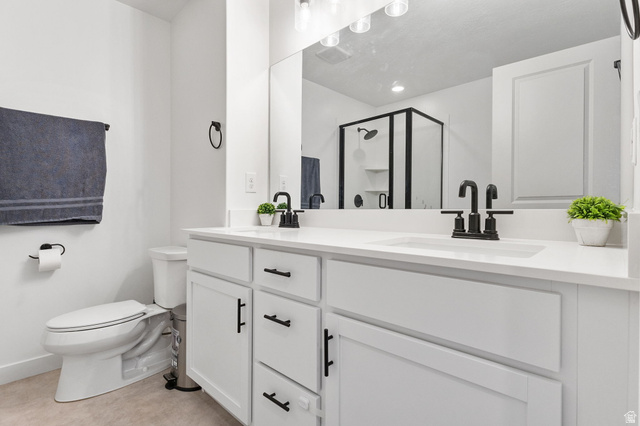 3473 Hardman Way Lehi, UT 84048 - Photo 12 of 22 Bathroom with a shower stall and double vanity