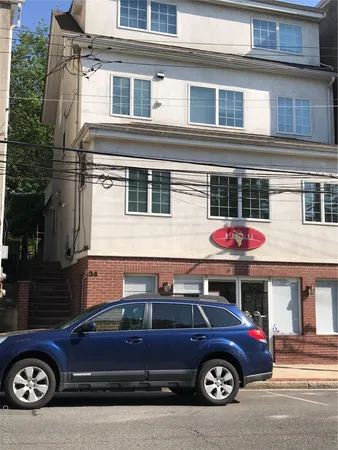 a car parked in front of a house
