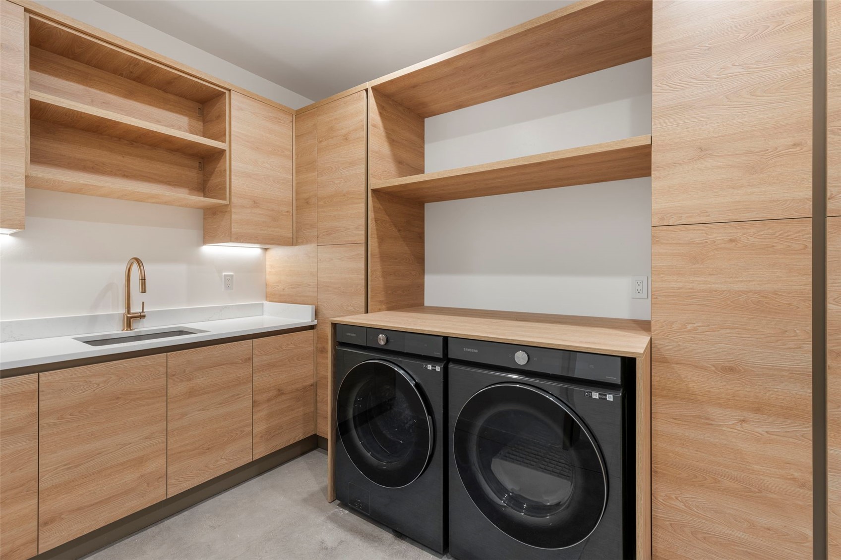 149 Game Trail Road Silverthorne, CO 80498 - Photo 40 of 49 Clothes washing area featuring cabinets, sink, and washer and clothes dryer