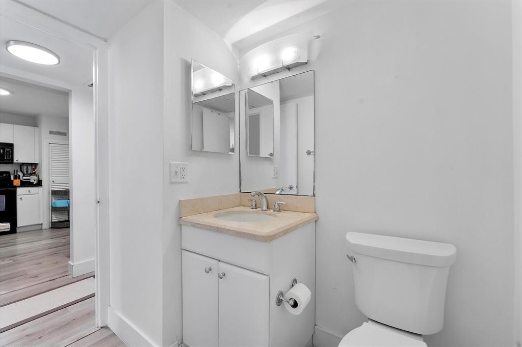 1900 South Ocean Boulevard, Unit 10J Pompano Beach, FL 33062 - Photo 14 of 36 a bathroom with a sink toilet and shower
