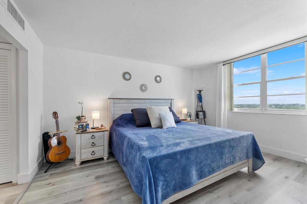 1900 South Ocean Boulevard, Unit 10J Pompano Beach, FL 33062 - Photo 15 of 36 a bedroom with a bed and a window