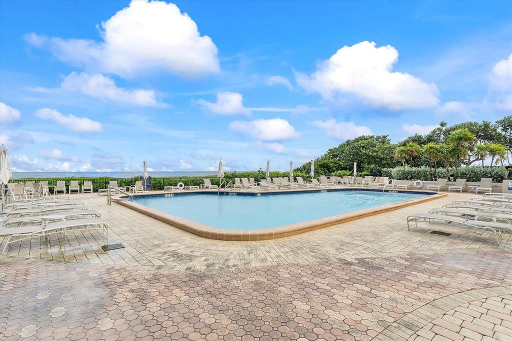 1900 South Ocean Boulevard, Unit 10J Pompano Beach, FL 33062 - Photo 21 of 36 a view of a swimming pool and an outdoor seating