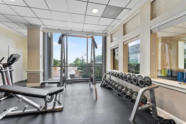 a bathroom with a glass door shower and a sink