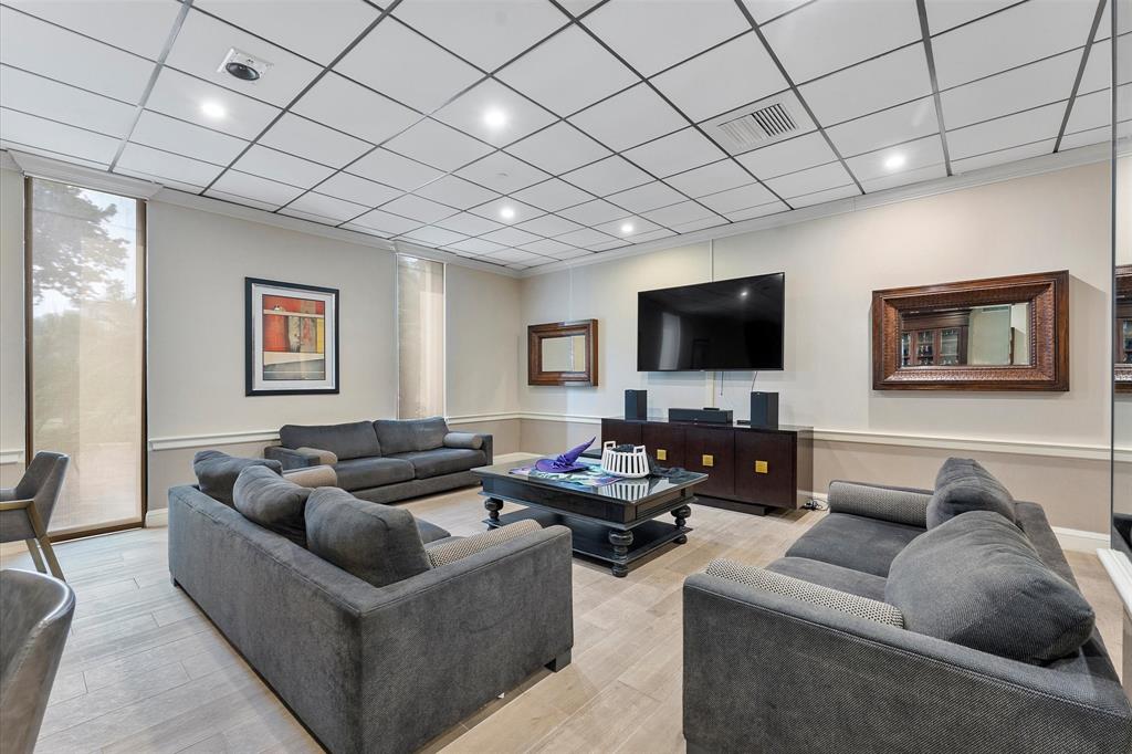 1900 South Ocean Boulevard, Unit 10J Pompano Beach, FL 33062 - Photo 26 of 36 a living room with furniture and a flat screen tv