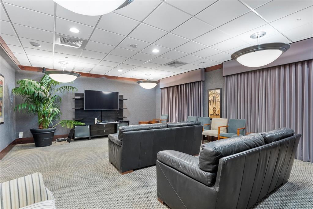 1900 South Ocean Boulevard, Unit 10J Pompano Beach, FL 33062 - Photo 27 of 36 a living room with furniture a flat screen tv and a large window