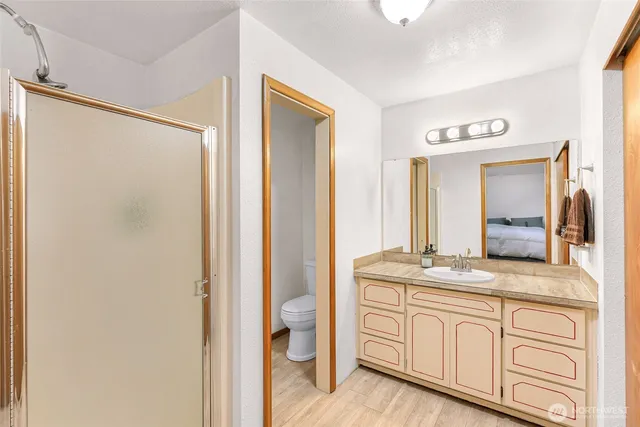 a bathroom with a granite countertop sink mirror and