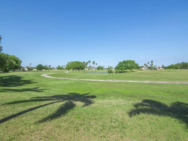 a view of a golf course with a big yard
