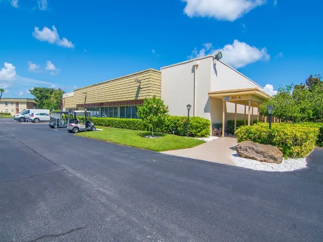a view of a house with a outdoor space and porch